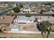 Aerial view of a backyard featuring a gravel landscape and a quaint garden area, enclosed by a white fence at 1757 W Argon St, Mesa, AZ 85201