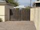 Gated backyard access with a gravel-covered area, providing security and extra parking at 1757 W Argon St, Mesa, AZ 85201