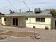 Charming backyard featuring gravel landscaping, patio, offering a blank canvas for outdoor living at 1757 W Argon St, Mesa, AZ 85201