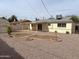 Inviting backyard with gravel landscaping, covered patio, and great potential for customization and enjoyment at 1757 W Argon St, Mesa, AZ 85201