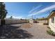 Private backyard with low-maintenance landscaping, a storage shed, and a covered patio at 1757 W Argon St, Mesa, AZ 85201