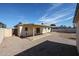 Low-maintenance backyard with a covered patio and storage shed, providing a private outdoor space at 1757 W Argon St, Mesa, AZ 85201