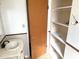 Bathroom shot with a white sink, storage cabinet and closet at 1757 W Argon St, Mesa, AZ 85201