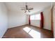 Bedroom with large window, ceiling fan, and wood-look flooring at 1757 W Argon St, Mesa, AZ 85201