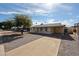 Lovely single-story home with covered front porch and extended driveway offering ample parking at 1757 W Argon St, Mesa, AZ 85201