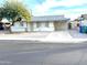 Charming single story home with a well-maintained front yard, long driveway, and a mature shade tree at 1757 W Argon St, Mesa, AZ 85201