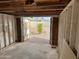 View from inside the garage; an open door lets in natural light and a view of the backyard at 1757 W Argon St, Mesa, AZ 85201
