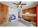 Functional kitchen featuring ceiling fan, laminate countertops, and access to dining area at 1757 W Argon St, Mesa, AZ 85201