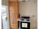 Functional kitchen featuring classic appliances, and an adjacent door for convenience and natural light at 1757 W Argon St, Mesa, AZ 85201