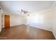Open living room featuring neutral paint colors, a ceiling fan, and easy access to adjacent rooms at 1757 W Argon St, Mesa, AZ 85201