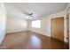 Bright living room with a ceiling fan, and a large window that allows natural light at 1757 W Argon St, Mesa, AZ 85201