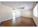 Spacious living room featuring neutral paint, a ceiling fan, and an entryway to additional rooms at 1757 W Argon St, Mesa, AZ 85201