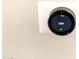 Nest thermostat mounted on a wall showing a temperature of 70 degrees at 1757 W Argon St, Mesa, AZ 85201