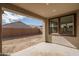 Covered back patio with great backyard view and exterior of the house at 17793 W Southgate Ave, Goodyear, AZ 85338