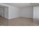 This living room boasts tile flooring and neutral walls, creating a bright and inviting space at 17793 W Southgate Ave, Goodyear, AZ 85338