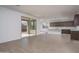 Open-concept living room with sliding glass doors that fills the space with natural light and tile flooring at 17793 W Southgate Ave, Goodyear, AZ 85338