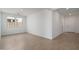 Bright and airy living room with tile floors, large windows, and neutral paint, providing ample natural light at 17793 W Southgate Ave, Goodyear, AZ 85338