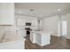 Modern kitchen featuring an island, stainless steel appliances, and sleek white cabinets at 18891 E Bruno Dr, Gold Canyon, AZ 85118