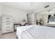 Bedroom featuring a desk area, a mirrored closet, carpet flooring, and bright natural light at 1920 W Lindner Ave # 249, Mesa, AZ 85202