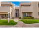 Multi-level condo building featuring well-maintained landscaping and a charming walkway at 1920 W Lindner Ave # 249, Mesa, AZ 85202