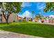 Scenic courtyard with lush green lawns, mature trees, and manicured landscaping at 1920 W Lindner Ave # 249, Mesa, AZ 85202
