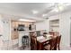 Charming dining area with ample lighting and a view into the kitchen at 1920 W Lindner Ave # 249, Mesa, AZ 85202