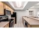 Well-lit kitchen featuring stainless steel appliances, ample counter space, and modern tile flooring at 1920 W Lindner Ave # 249, Mesa, AZ 85202