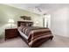 Cozy bedroom featuring stylish decor, two bedside tables, and comfortable bedding at 1920 W Lindner Ave # 249, Mesa, AZ 85202