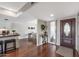 Inviting foyer with hardwood floors and a view of the dining area at 19805 N 99Th Dr, Sun City, AZ 85373