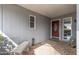 Inviting front porch with stone bench seating and decorative features at 19805 N 99Th Dr, Sun City, AZ 85373