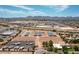 Aerial view of an equestrian facility, arena, RV parking, and residential houses at 20329 E Bronco Dr, Queen Creek, AZ 85142
