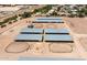 Aerial view of an equestrian center showing stables, paddocks, and riding rings at 20329 E Bronco Dr, Queen Creek, AZ 85142