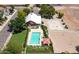 Aerial view of a pool, basketball court, and barn in a residential area at 20329 E Bronco Dr, Queen Creek, AZ 85142