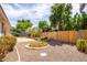 Backyard featuring desert landscaping with a lush green perimeter at 20329 E Bronco Dr, Queen Creek, AZ 85142