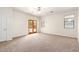 Bright bedroom with a ceiling fan and two windows to provide plenty of natural light and fresh air at 20329 E Bronco Dr, Queen Creek, AZ 85142