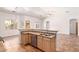Open concept kitchen with stainless steel appliances, light wood cabinets, and breakfast bar at 20329 E Bronco Dr, Queen Creek, AZ 85142