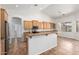 Open-concept kitchen with stainless steel appliances, ample counter space, and modern finishes at 20329 E Bronco Dr, Queen Creek, AZ 85142