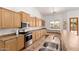 Bright kitchen featuring stainless steel appliances, light wood cabinets, and modern fixtures at 20329 E Bronco Dr, Queen Creek, AZ 85142