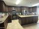 Spacious kitchen with island, stainless steel appliances, and granite countertops offering ample space at 216 N 88Th St, Mesa, AZ 85207