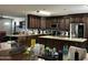 An open kitchen features stainless steel appliances, granite countertops, and generous cabinet space, perfect for cooking at 216 N 88Th St, Mesa, AZ 85207