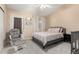 Charming bedroom featuring a cozy glider chair, decor shelves and a comfortable queen-sized bed at 2315 W Union Hills Dr # 106, Phoenix, AZ 85027