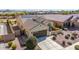 Aerial view of a well-maintained home featuring a tile roof, solar panels, and desert landscaping at 27621 N 174Th Dr, Surprise, AZ 85387