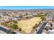 Wide aerial shot of a community with a large common area and mountain views on a clear day at 27621 N 174Th Dr, Surprise, AZ 85387