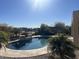 Lush backyard with a free form in-ground pool and mature trees at 27621 N 174Th Dr, Surprise, AZ 85387