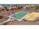 Aerial shot of a green outdoor basketball court in a well-maintained community park at 27621 N 174Th Dr, Surprise, AZ 85387