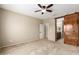 Large carpeted bedroom with ensuite bathroom and barn-door closet, offering lots of space and privacy at 27621 N 174Th Dr, Surprise, AZ 85387