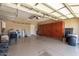 Garage with epoxy floors, storage cabinets and overhead racks at 27621 N 174Th Dr, Surprise, AZ 85387