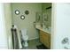 Cozy bathroom with decorative mirrors, a single sink vanity, and a walk-in shower at 2929 W Yorkshire Dr # 1028, Phoenix, AZ 85027