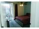 Cozy bedroom with sliding glass doors leading to a private patio or balcony at 2929 W Yorkshire Dr # 1028, Phoenix, AZ 85027