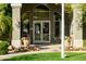 Inviting clubhouse entrance with potted flowers, manicured lawn and decorative lighting at 2929 W Yorkshire Dr # 1028, Phoenix, AZ 85027